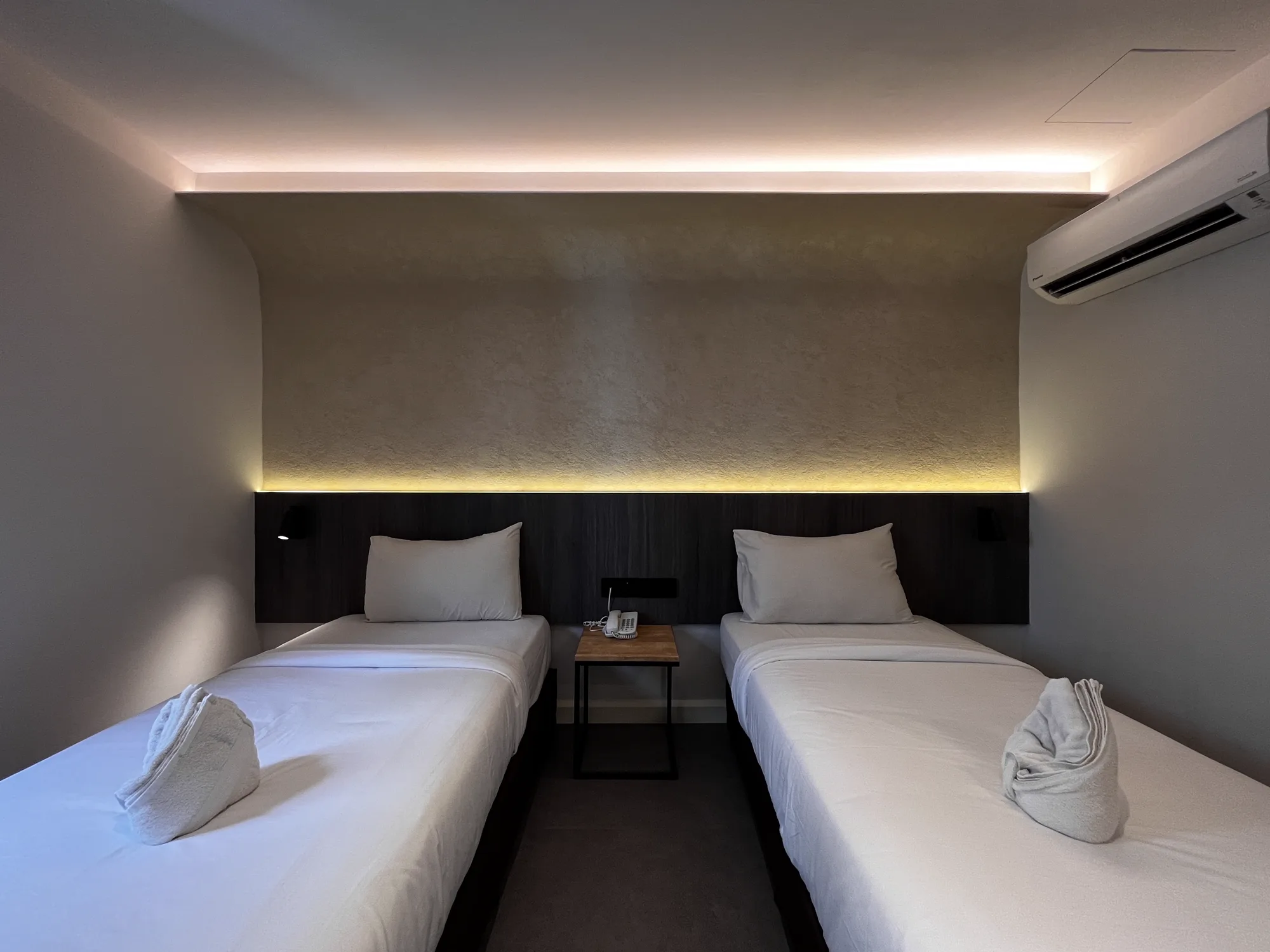 MyHotel twin-bed room with illuminated headboard wall