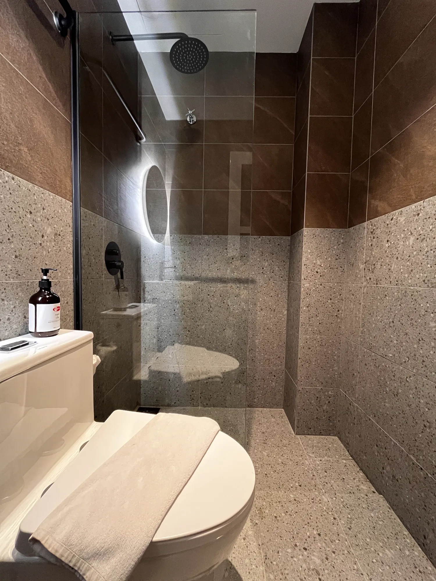 MyHotel bathroom shower enclosure and stone wall finishes