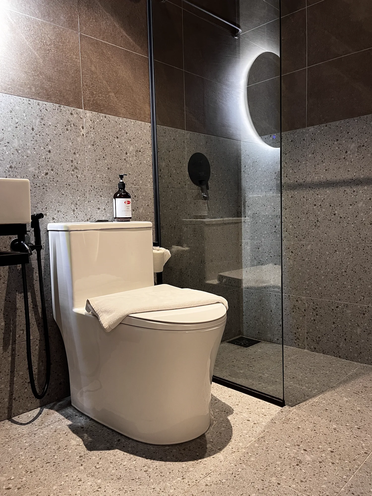 MyHotel bathroom with enclosed shower and contemporary stone finishes